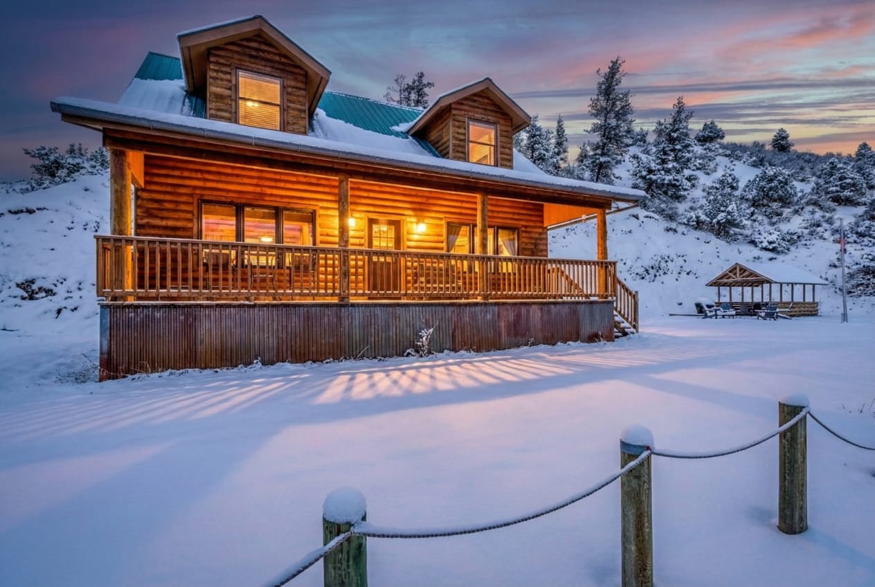 Cabin exterior with snow-covered mountains